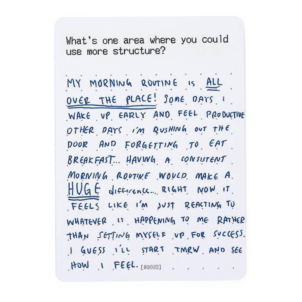 Handwritten text on a prompt card discussing morning routines and structure.